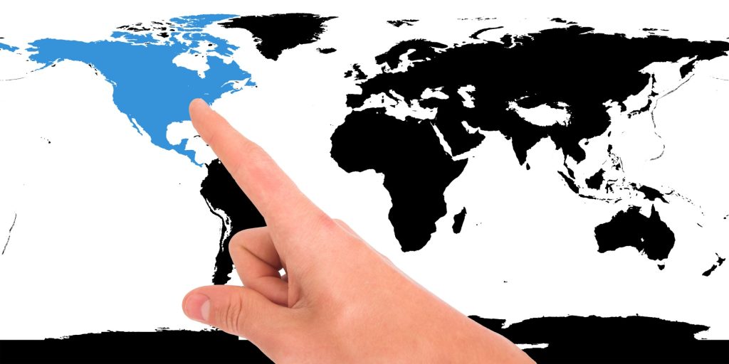 Man pointing to the USA on a map