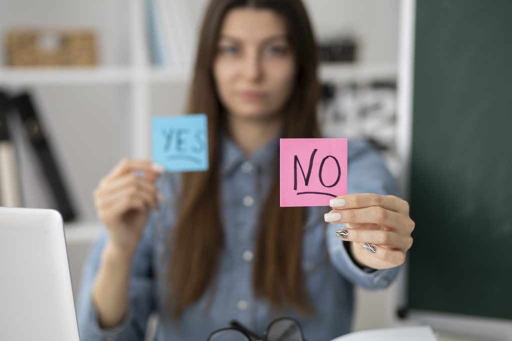 woman holding sign that says no